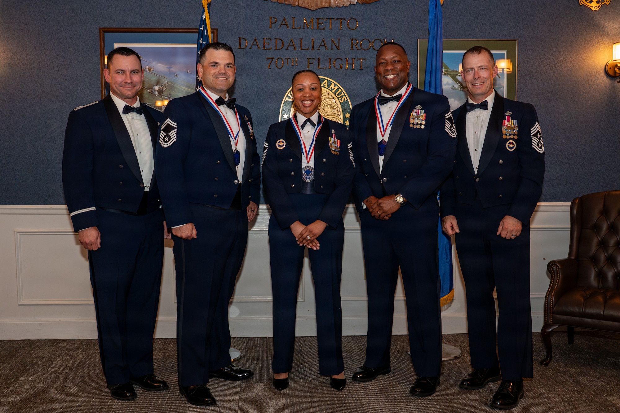 5 Airmen in mess dress pose for a group photo