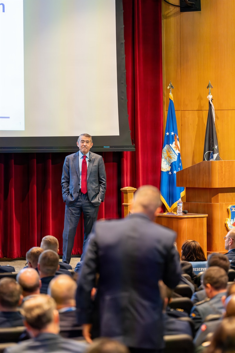 Edwin H. Oshiba, a member of the Senior Executive Service and administrative assistant to the Secretary of the Air Force, engages with attendees during the National Security Forum at Air University, Maxwell Air Force Base, Alabama, May 5, 2026.