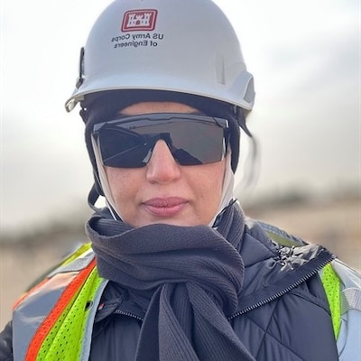 Woman wearing personal protective equipment.