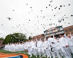 The Coast Guard Academy Class of 2025 throws their combination covers into the air during a flyover at the 144th Commencement Exercises at the Coast Guard Academy, May 21, 2025. The ceremony marks the culmination of the 200-week cadet training program. (U.S. Coast Guard photo by Petty Officer 3rd Class Matt Thieme.)