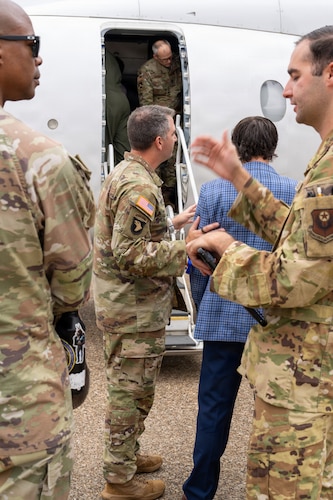 National Security Forum and Gathering of Eagles attendees board an aircraft during an Airpower demonstration at Maxwell Air Force Base, Alabama, May 6, 2026.