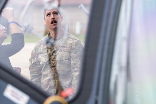 A U.S. Air Force Airman explains aircraft systems to National Security Forum and Gathering of Eagles attendees during an Airpower demonstration at Maxwell Air Force Base, Alabama, May 6, 2026.