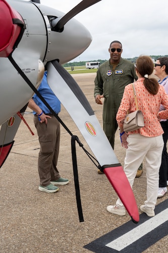 A U.S. Air Force pilot speaks with National Security Forum and Gathering of Eagles attendees beside a U.S. Air Force aircraft during an Airpower demonstration at Maxwell Air Force Base, Alabama, May 6, 2026.
