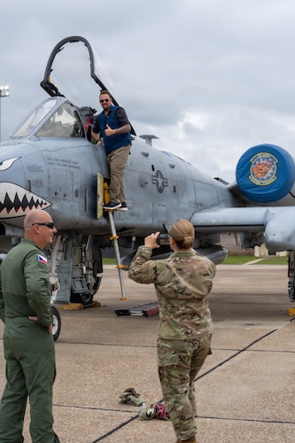 A National Security Forum and Gathering of Eagles attendee poses for a photo aboard an A-10 Thunderbolt II aircraft during an Airpower demonstration at Maxwell Air Force Base, Alabama, May 6, 2026.