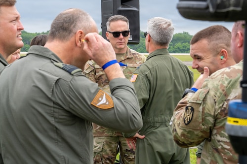 Chief Master Sgt. Raun M. Howell, Air University command chief master sergeant, speaks with Lt. Gen. Daniel H. Tulley, commander and president of Air University, during an Airpower demonstration for National Security Forum and Gathering of Eagles attendees at Maxwell Air Force Base, Alabama, May 6, 2026.