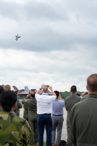 National Security Forum and Gathering of Eagles attendees watch an F-22 Demonstration Team aerial performance during an Airpower demonstration at Maxwell Air Force Base, Alabama, May 6, 2026.