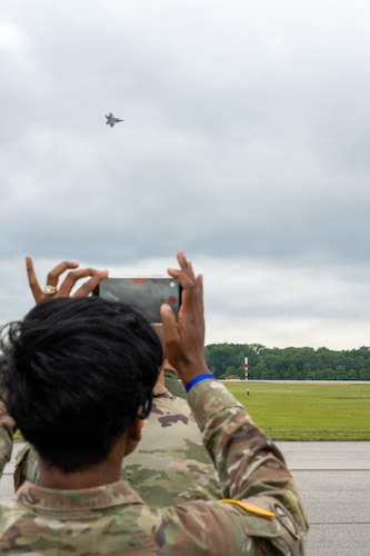 National Security Forum and Gathering of Eagles attendees watch an F-22 Demonstration Team aerial performance during an Airpower demonstration at Maxwell Air Force Base, Alabama, May 6, 2026.