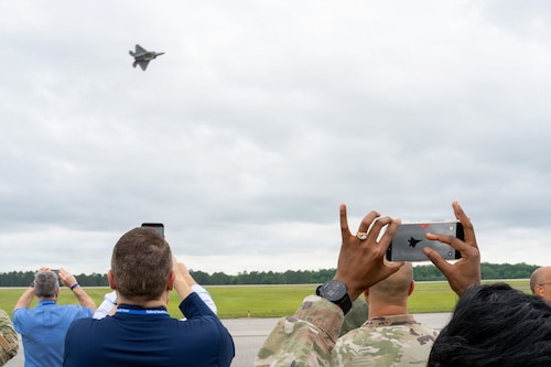 Attendees record an F-22 Demonstration Team aerial performance during an Airpower demonstration at Maxwell Air Force Base, Alabama, May 6, 2026.