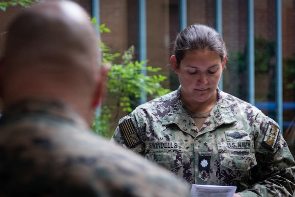Cmdr. Stacey Swindells, head of the Healthcare Business department, participates in a “Blessing of the Hands” ceremony held at Navy Medicine Readiness and Training Command Cherry Point on May 6.