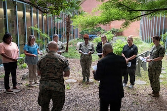 Nurses from Navy Medicine Readiness and Training Command Cherry Point gather in the facility’s atrium for a “Blessing of the Hands” ceremony, May 6. Led by Navy Chaplain Lt. Cmdr. Daniel Bruno and Catholic Priest Father Ignatius Madamere, the ceremony marked the beginning of National Nurses Week, which is observed from May 6-12.