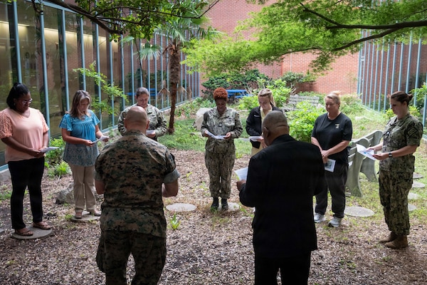 Nurses from Navy Medicine Readiness and Training Command Cherry Point gather in the facility’s atrium for a “Blessing of the Hands” ceremony, May 6. Led by Navy Chaplain Lt. Cmdr. Daniel Bruno and Catholic Priest Father Ignatius Madamere, the ceremony marked the beginning of National Nurses Week, which is observed from May 6-12.