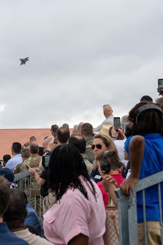 National Security Forum and Gathering of Eagles attendees watch an F-22 Demonstration Team aerial performance during an Airpower demonstration at Maxwell Air Force Base, Alabama, May 6, 2026.