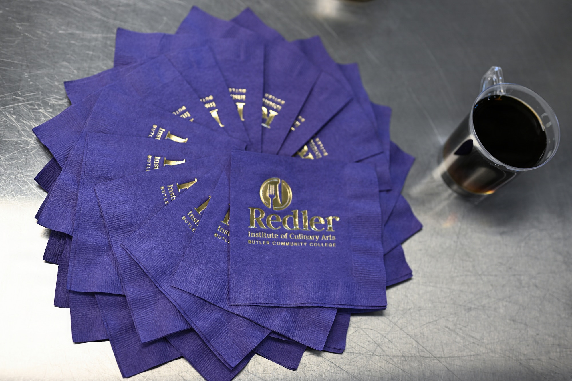 Redler Institute of Culinary Arts displays an artistic napkin setting in Andover, Kansas, April 28, 2026. The display was laid out for a luncheon prepared by visiting Airmen from the 22nd Force Support Squadron. (U.S. Air Force photo by Senior Airman Amelio Brown)
