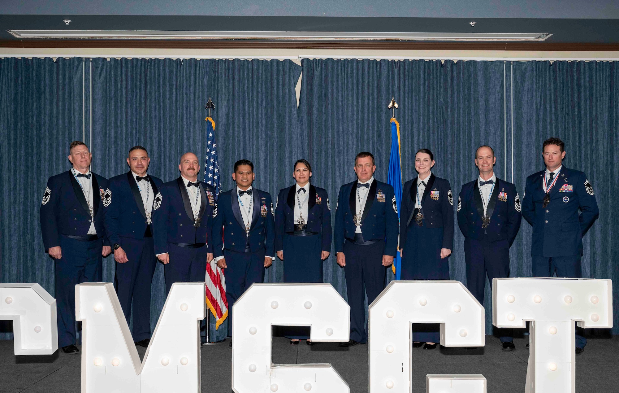 Airmen pose for a photo.