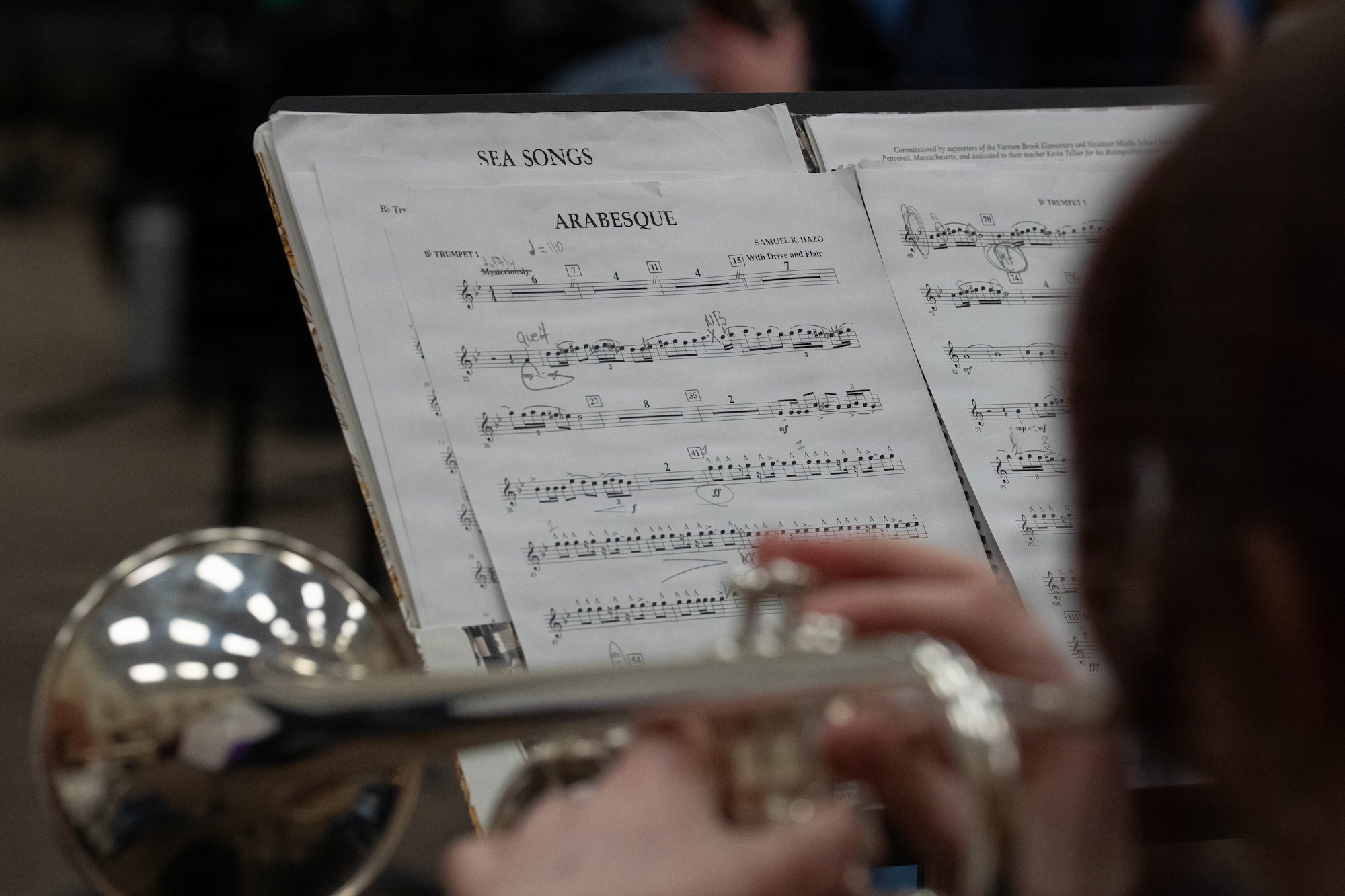 An Eagle River High School student plays sheet music during a class led by the U.S. Air Force Band of the Pacific-Hawaii in Eagle River, Alaska, April 21, 2026. The band visited the school to mentor students and perform as part of a community relations tour across the state, highlighting the importance of fine arts education and supporting military families during the Month of the Military Child. (U.S. Air Force photo by Airman 1st Class Keola Vischi)