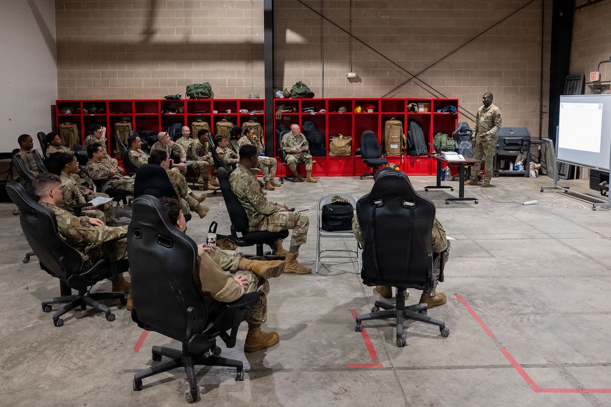 An Airman gives a briefing to other Airmen