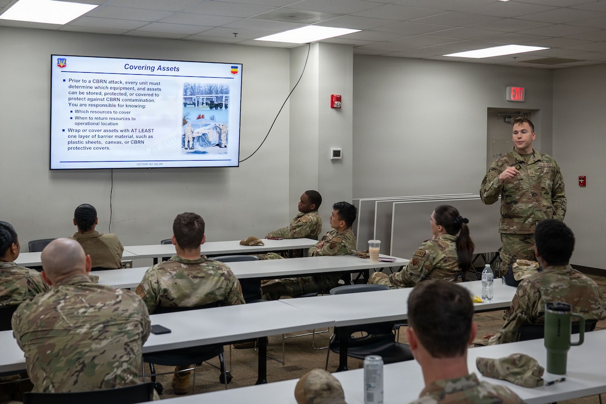 An Airman gives a presentation to other Airmen