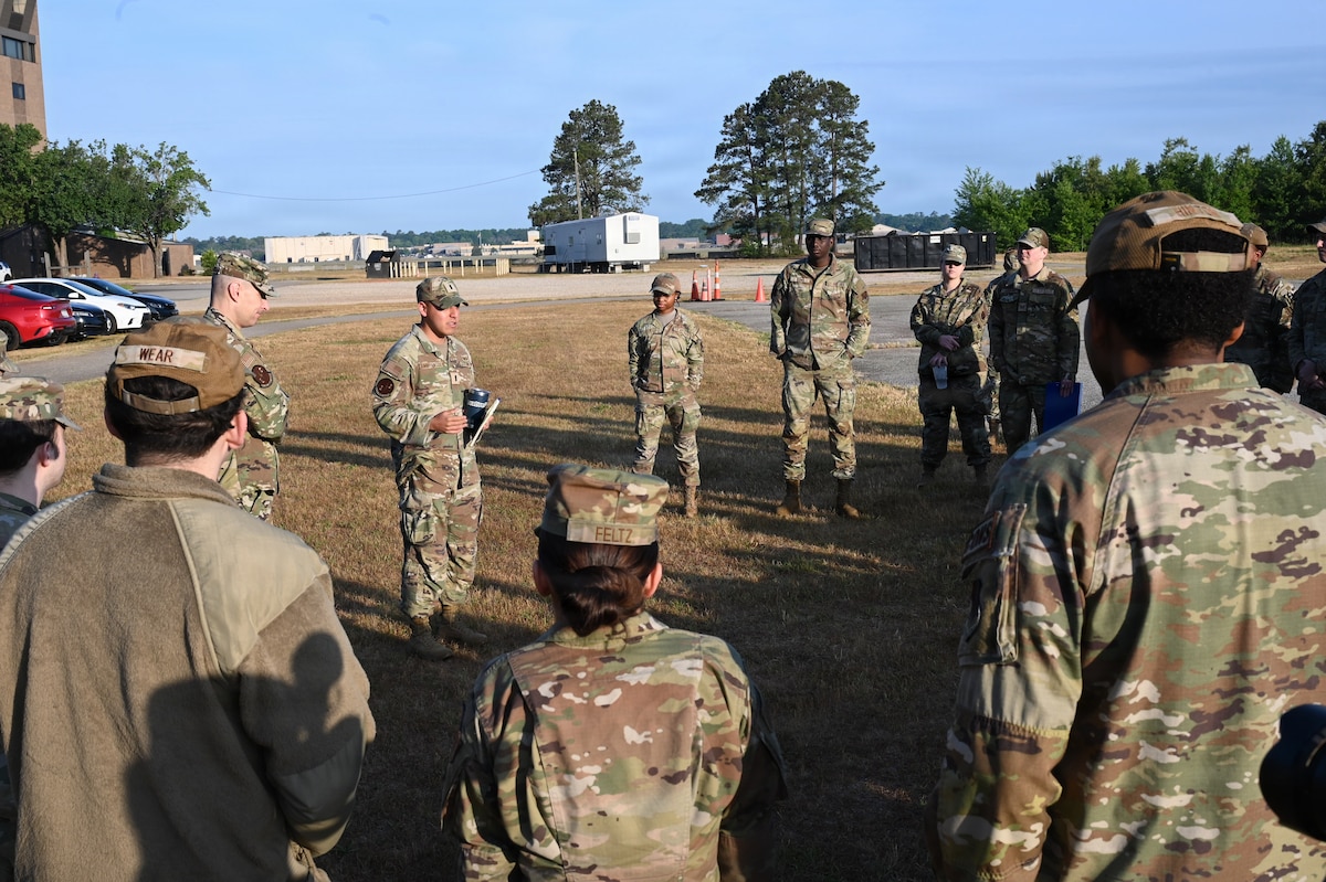 An Airman gives a briefing to other Airman