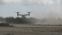 U.S. Marines assigned to 1st Battalion, 5th Marine Regiment, Marine Rotational Force – Darwin, hold security as an MV-22B Osprey, assigned to Marine Medium Tiltrotor Squadron 268, approaches the flightline during an airfield seizure as a part of Exercise Balikatan 2026 at Balabac Island, Philippines, May 3, 2026.