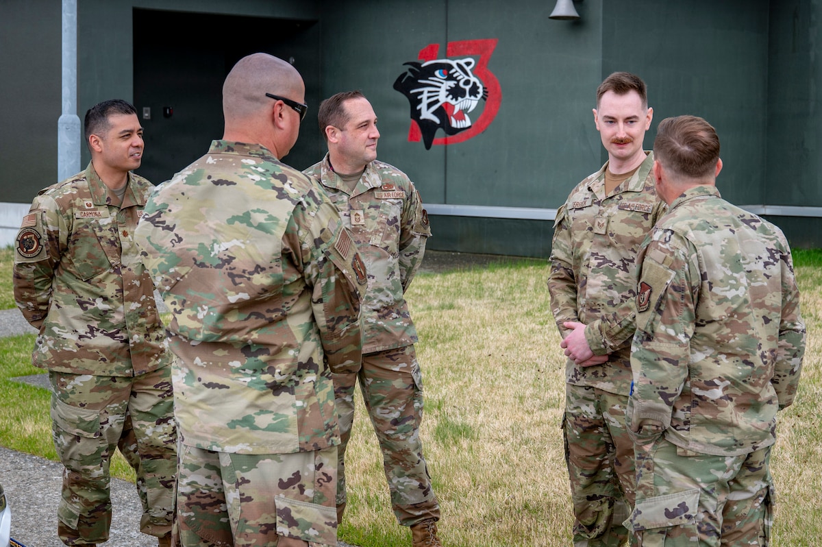 35th Fighter Wing (FW) leaders greet members assigned to the 13th Fighter Generation Squadron before beginning a Wild Weasel Walk-through at Misawa Air Base, Japan, May 4, 2026. Walk-throughs provide 35th FW leaders with a firsthand look at unit operations, capabilities, and mission execution. (U.S. Air Force photo by Senior Airman Brittany Russell)