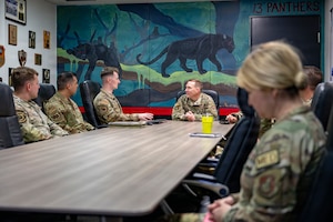 U.S. Air Force Staff Sgt. Stephen Terrick, third from left, 13th Fighter Generation Squadron noncommissioned officer in charge of maintenance managers, briefs Col. Paul Davidson, 35th Fighter Wing commander, during a Wild Weasel Walk-through at Misawa Air Base, Japan, May 4, 2026. Davidson recognized Terrick as Wild Weasel of the Week for his contributions to maintaining aircraft readiness through effective maintenance tracking and coordination. (U.S. Air Force photo by Senior Airman Brittany Russell)