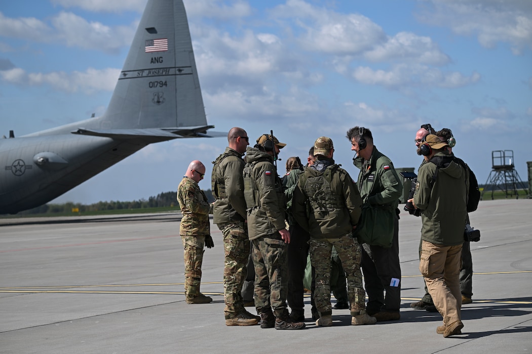 A Polish air force C-130H Hercules aircraft drops cargo during Rodeo Day in support of Hussar Saber 26-1.
