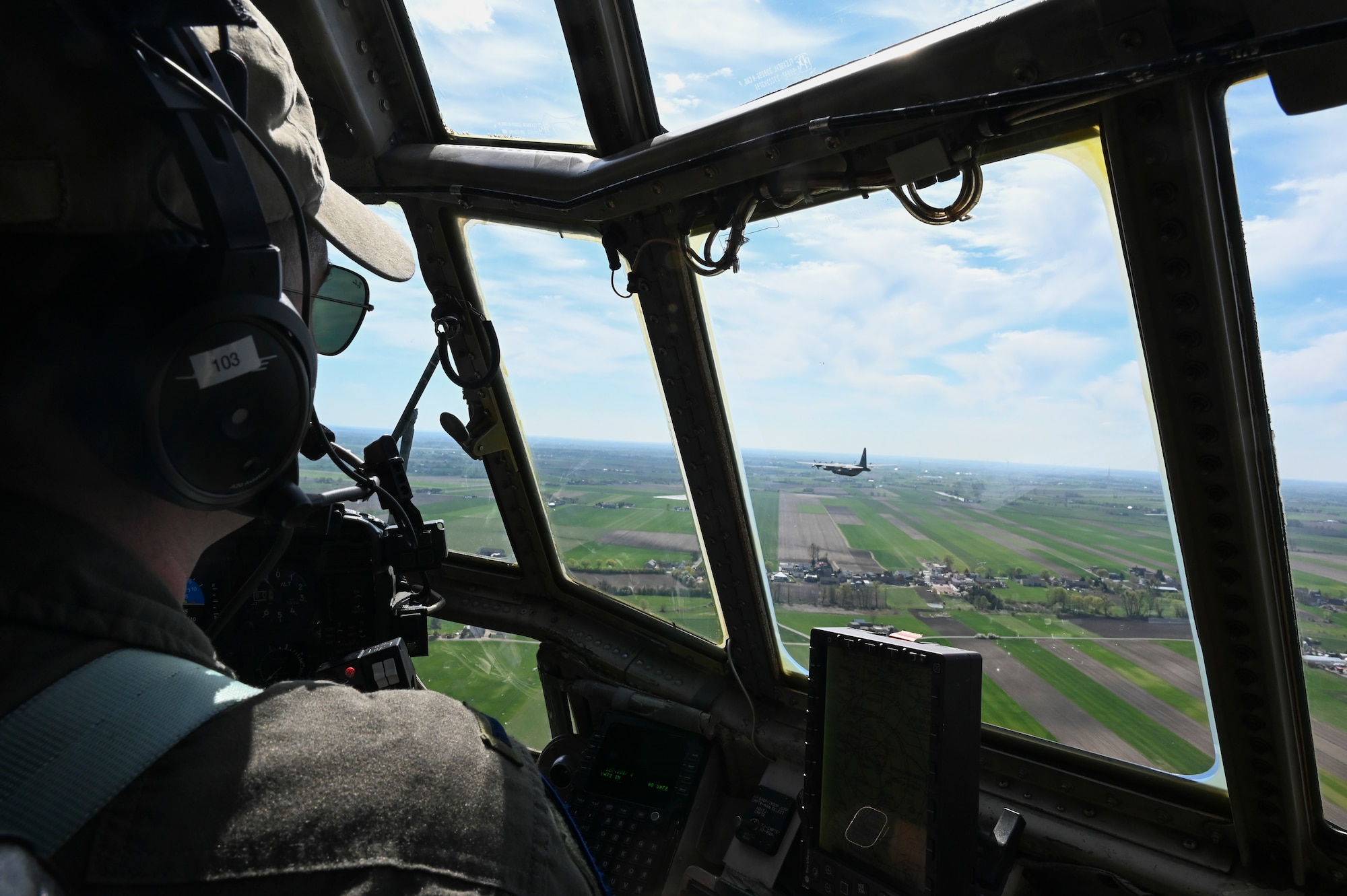 U.S. Air Force 1st Lt. David Kocher, 180th Airlift Squadron pilot, flies over Polish skies on a C-130H Hercules aircraft during Hussar Saber 26-1.