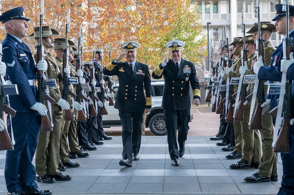 Adm. David Johnston AC RAN, Chief of the Australian Defence Force, left, and Adm. Samuel J. Paparo, commander of U.S. Indo-Pacific Command, render a salute during a ceremonial welcome at the Russell Offices for U.S. Australia MILREPs Forum in Canberra, Australia, May 5, 2026. The U.S.-Australia MILREPs Forum is a critical senior military engagement that aligns defense priorities and establishes a foundation for the Australia–United States Ministerial Consultations, the principal forum through which allied leadership elevates the alliance's most consequential bilateral decisions to the highest levels of government. USINDOPACOM is committed to enhancing stability in the Indo-Pacific region by promoting security cooperation, encouraging peaceful development, responding to contingencies, deterring aggression and, when necessary, prevailing in conflict. (U.S. Navy photo by Mass Communication Specialist 1st Class Ryan D. McLearnon)
