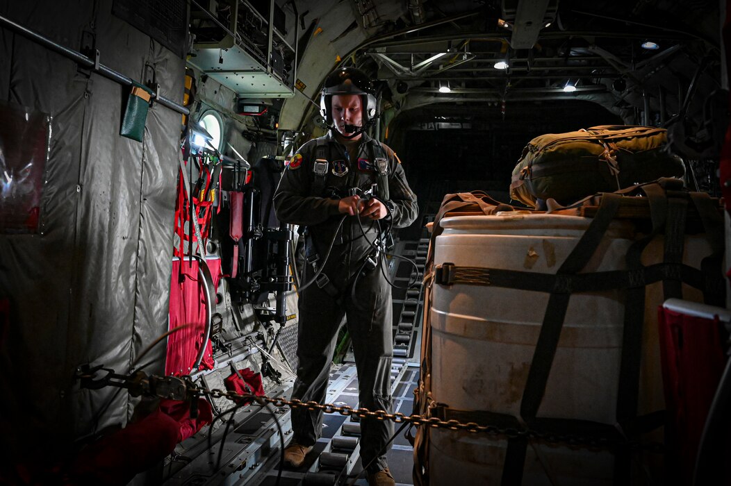 U.S. Air Force Senior Airmen Gavin Clark, 180th Airlift Squadron loadmaster, prepares to drop cargo from a C-130H Hercules aircraft assigned to the 139th Airlift Wing, during Hussar Saber 26-1.