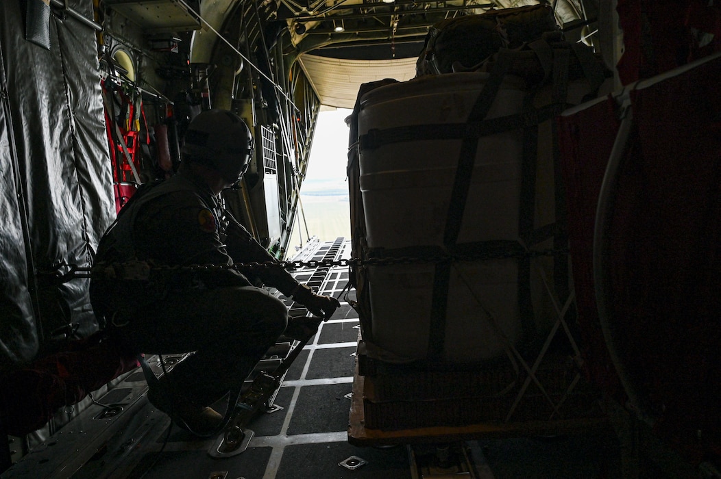 U.S. Air Force Senior Airman Gavin Clark, 180th Airlift Squadron loadmaster, prepares to drop cargo from a C-130H Hercules aircraft assigned to the 139th Airlift Wing, during Hussar Saber 26-1.