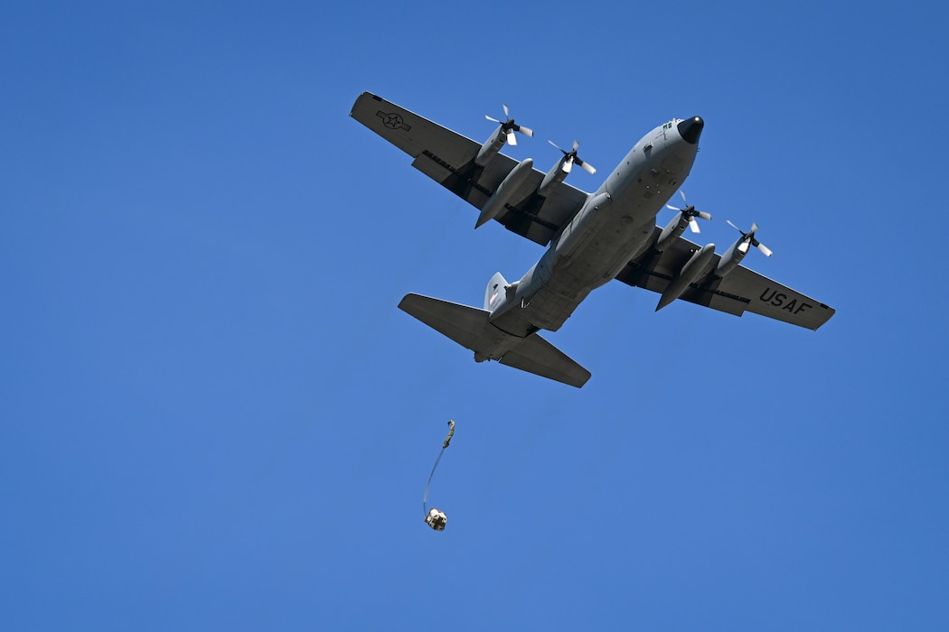 A Polish C-130H Hercules aircraft drops cargo during Rodeo Day in support of Hussar Saber 26-1.