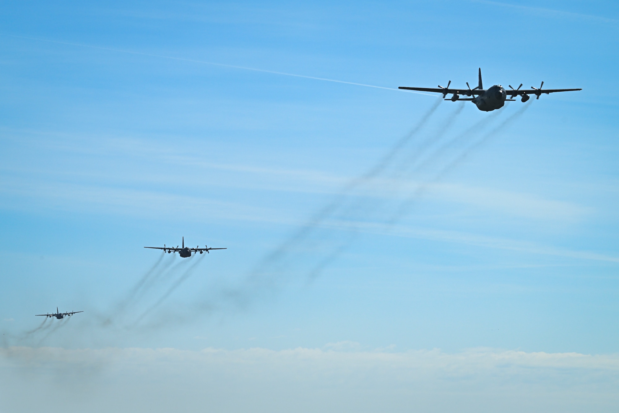 Three C-130H Hercules aircraft assigned to the 139th Airlift Wing and the Polish air force fly over the skies of Poland during Rodeo Day in support of Hussar Saber 26-1.