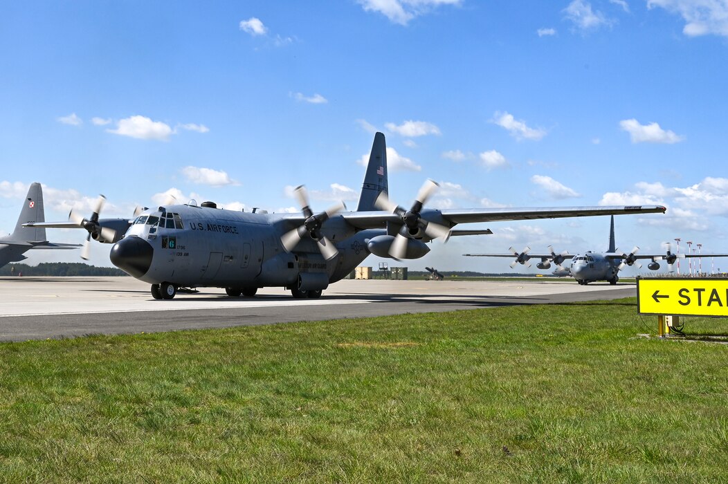 Two C-130H Hercules aircraft assigned to the 139th Airlift Wing taxi on the flight line during Rodeo Day in support of Hussar Saber 26-1.