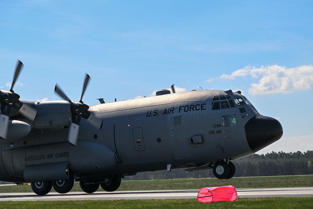 A C-130H Hercules aircraft assigned to the 139th Airlift Wing takes off during Rodeo Day in support of Hussar Saber 26-1.