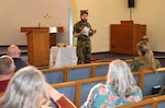 1Lt. Ida Weltzien, chaplain (l), in the Norwegian Navy and MAJ Joachim Haaland (r), chaplain, Møre og Fjordane 11th Home Guard, distributing communion elements during a non-denominational service at the Landstuhl Regional Medical Center chapel, April 29.