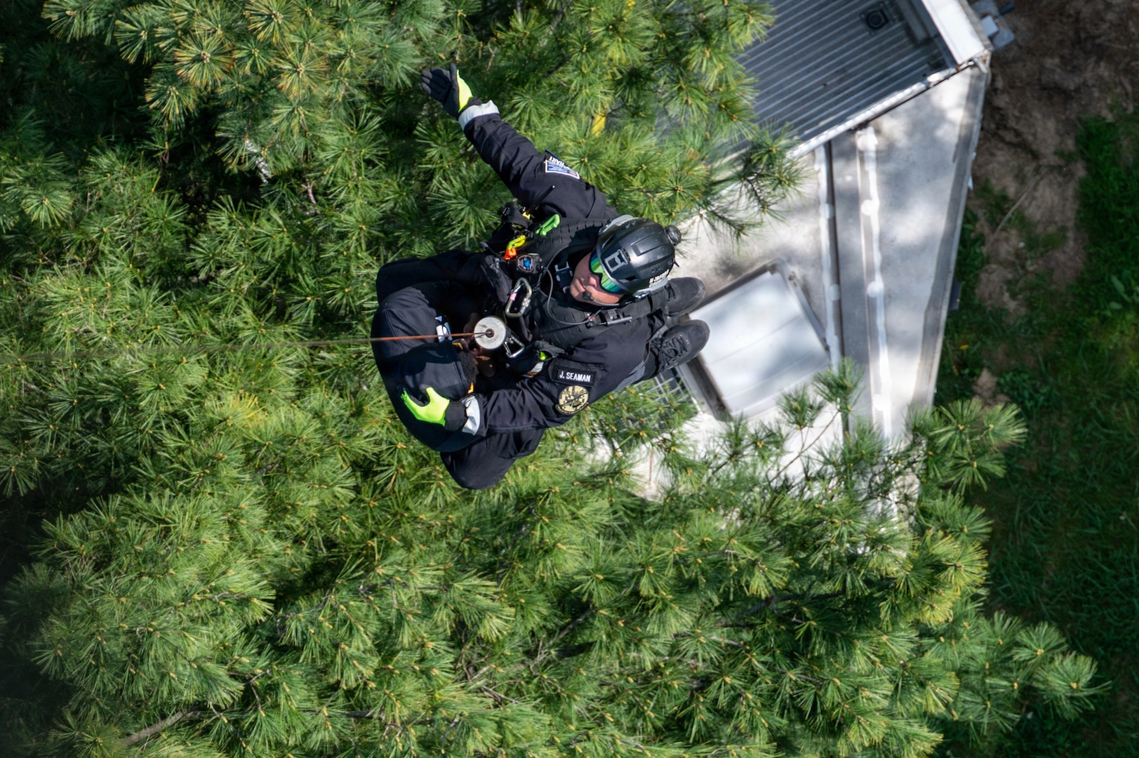A technician from the Maryland Helicopter Aquatic Response Team and a member of the Maryland Air National Guard Student Flight are hoisted by a Maryland Army National Guard UH-60 Black Hawk during a Maryland Emergency Management Search-and-Rescue Exercise at Gunpowder Falls State Park, Maryland, April 23, 2026.