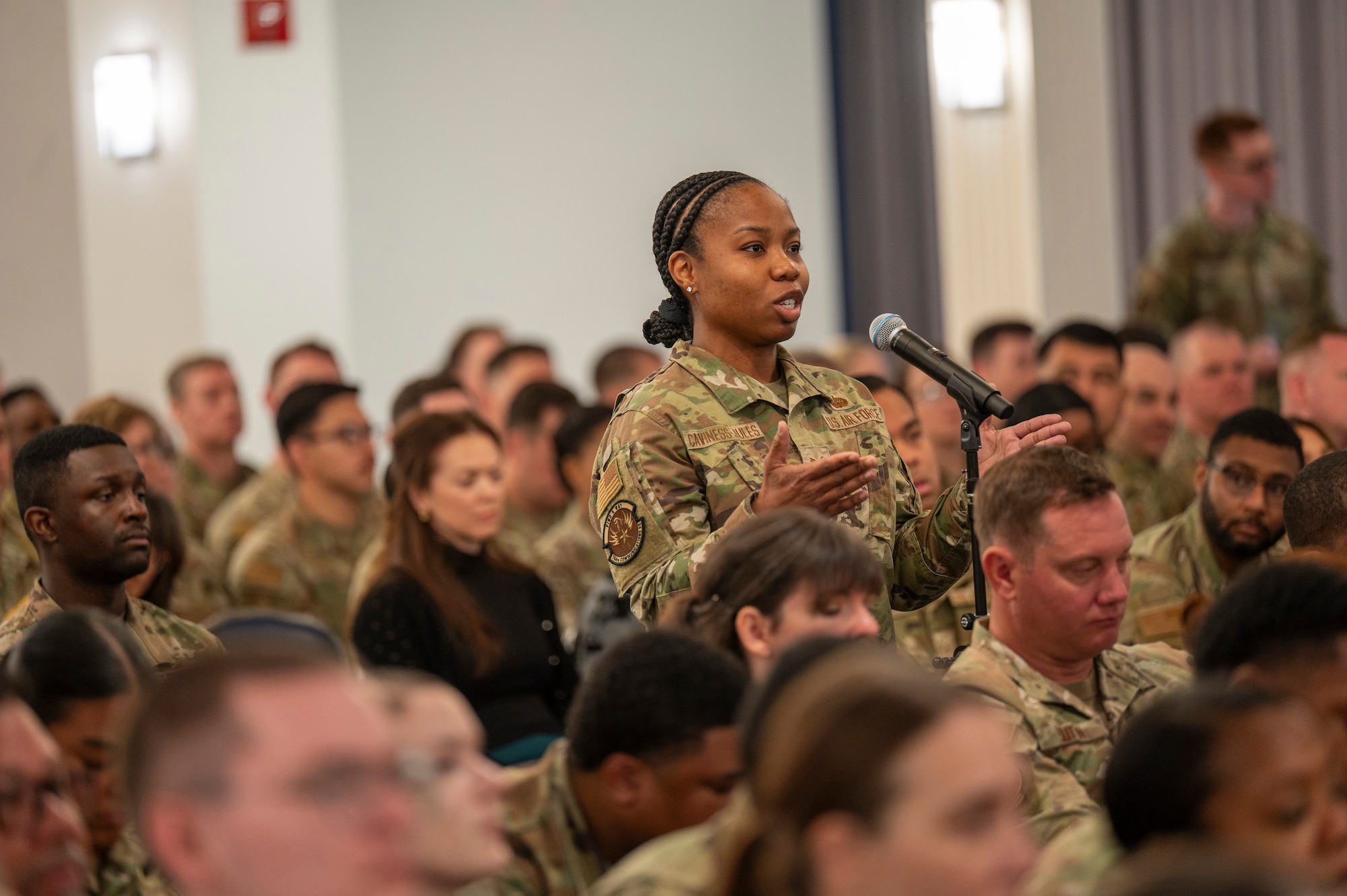 U.S. Air Force Tech. Sgt. Crystyle Caviness-Jules, project manager from 794th Communications Squadron, asks a question during an All Call with Chief Master Sergeant of the Air Force David Wolfe at Joint Base Anacostia-Bolling, Washington, D.C., on May 6, 2026. During the call, the floor was open for Airmen to ask questions about the evolving mission and priorities of the force. (U.S. Air Force photo by Senior Airman Shanel Toussaint)
