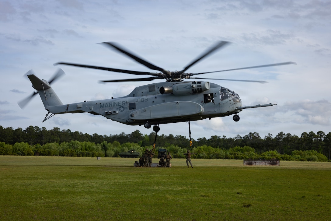 A U.S. Marine Corps CH-53E Super Stallion assigned to Marine Heavy Helicopter Training Squadron 302 (HMHT) 302, Marine Aircraft Group 29, 2nd Marine Aircraft Wing, lifts a payload during helicopter support team operations training as part of a field exercise near Marine Corps Base Camp Lejeune, North Carolina, April 30, 2026. Combat Logistics Battalion 2 conducted the exercise to complete training and readiness requirements, sustain company competencies, and enhance operational readiness in support of future mission requirements. (U.S. Marine Corps photo by Sgt. Rafael Brambila-Pelayo)