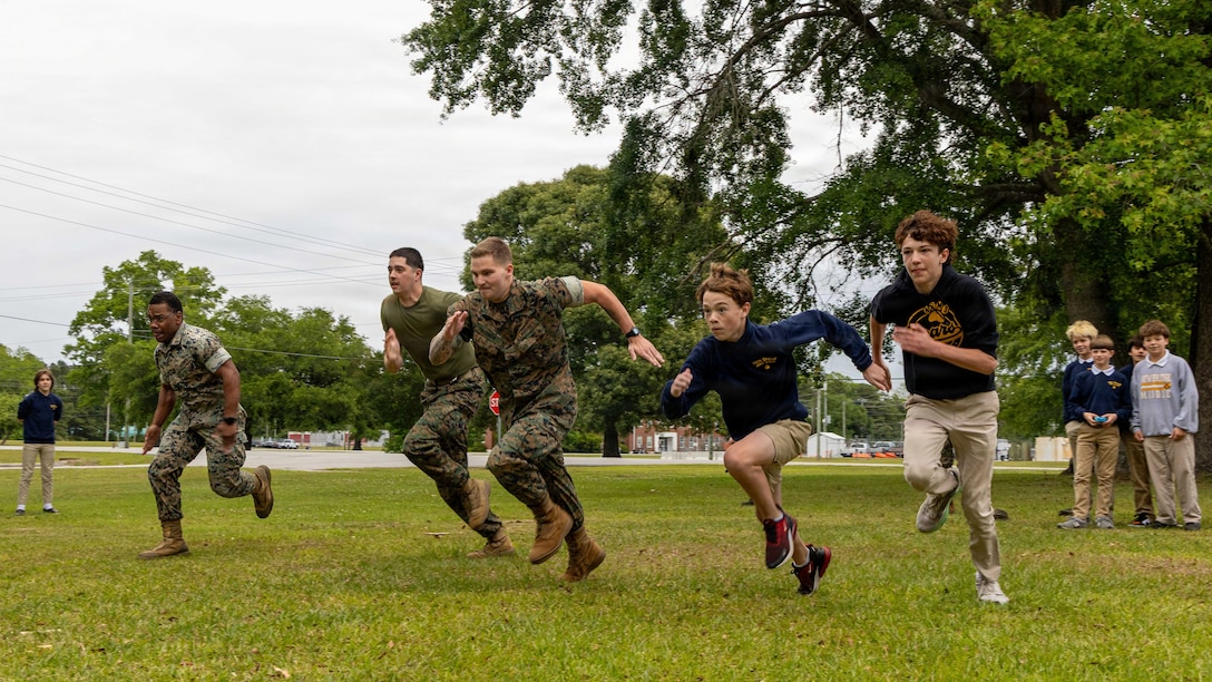 U.S. Marines with the 24th Marine Expeditionary Unit, race students from the New Bridge Middle School at Marine Corps Base Camp Lejeune, May 1, 2026. The event was designed to foster positive relationships between the military and the local community while giving students a firsthand look at Marine Corps equipment. (U.S. Marine Corps photos by Cpl. Daniel R. Garcia)