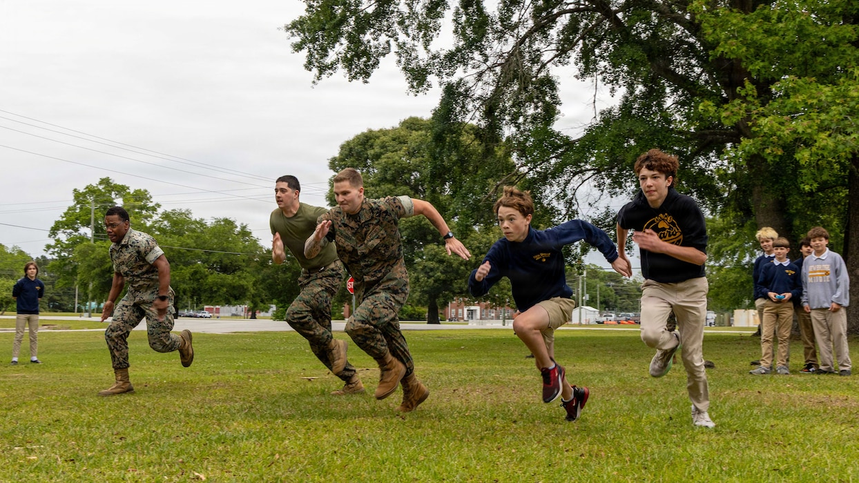 U.S. Marines with the 24th Marine Expeditionary Unit, race students from the New Bridge Middle School at Marine Corps Base Camp Lejeune, May 1, 2026. The event was designed to foster positive relationships between the military and the local community while giving students a firsthand look at Marine Corps equipment. (U.S. Marine Corps photos by Cpl. Daniel R. Garcia)