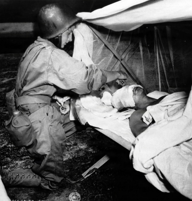 Image of nurses treating patients.