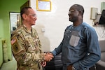 U.S. Army Lt. Col. Gene Enriquez, State Partnership Program director with the Vermont National Guard, greets Dr. Amadou Mbaye Diouf, chief physician, during a key leader engagement in Thiès, Senegal, May 4, 2026, to discuss regional healthcare priorities and inform planning for a 2027 medical readiness exercise.