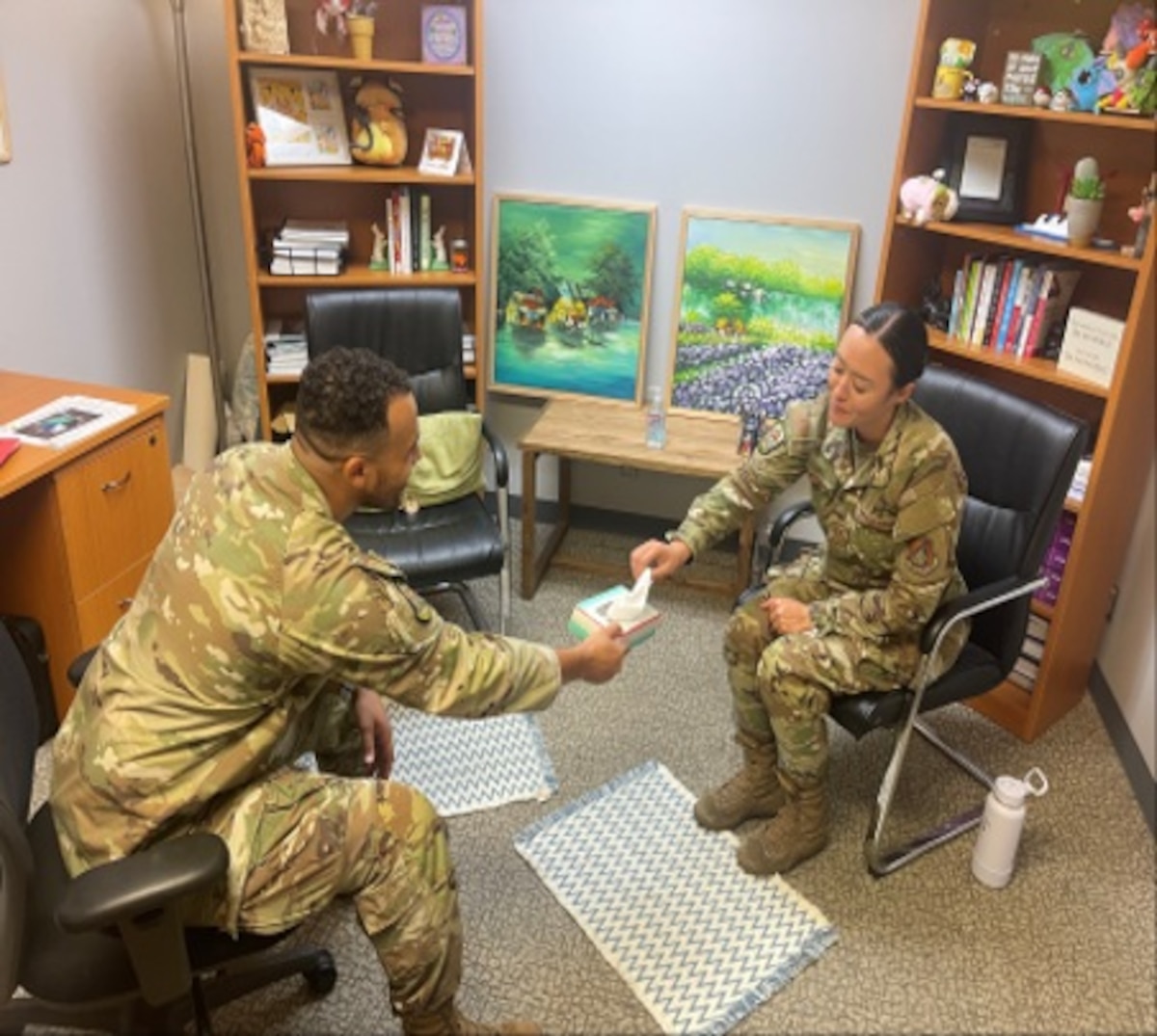 Image of Airmen having a conversation.