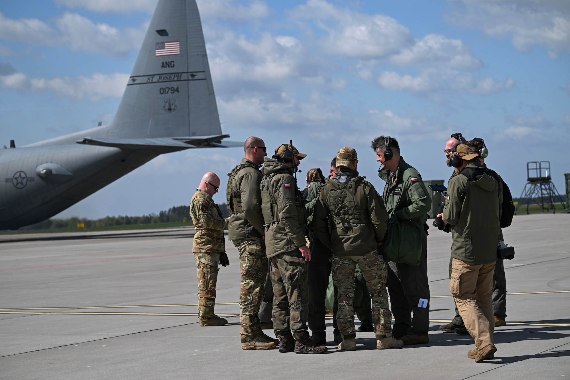 A Polish air force C-130H Hercules aircraft drops cargo during Rodeo Day in support of Hussar Saber 26-1.