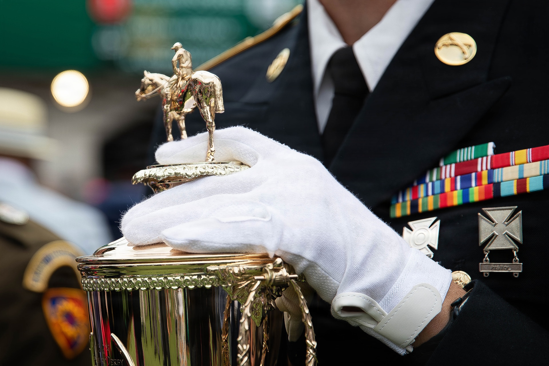 Staff Sgt. Jonathan Miller of the 617th Military Police Company escort the winner's trophy onto the Paddock at the 152nd running of the Kentucky Derby at Churchill Downs in Louisville, Kentucky, May 2, 2026.