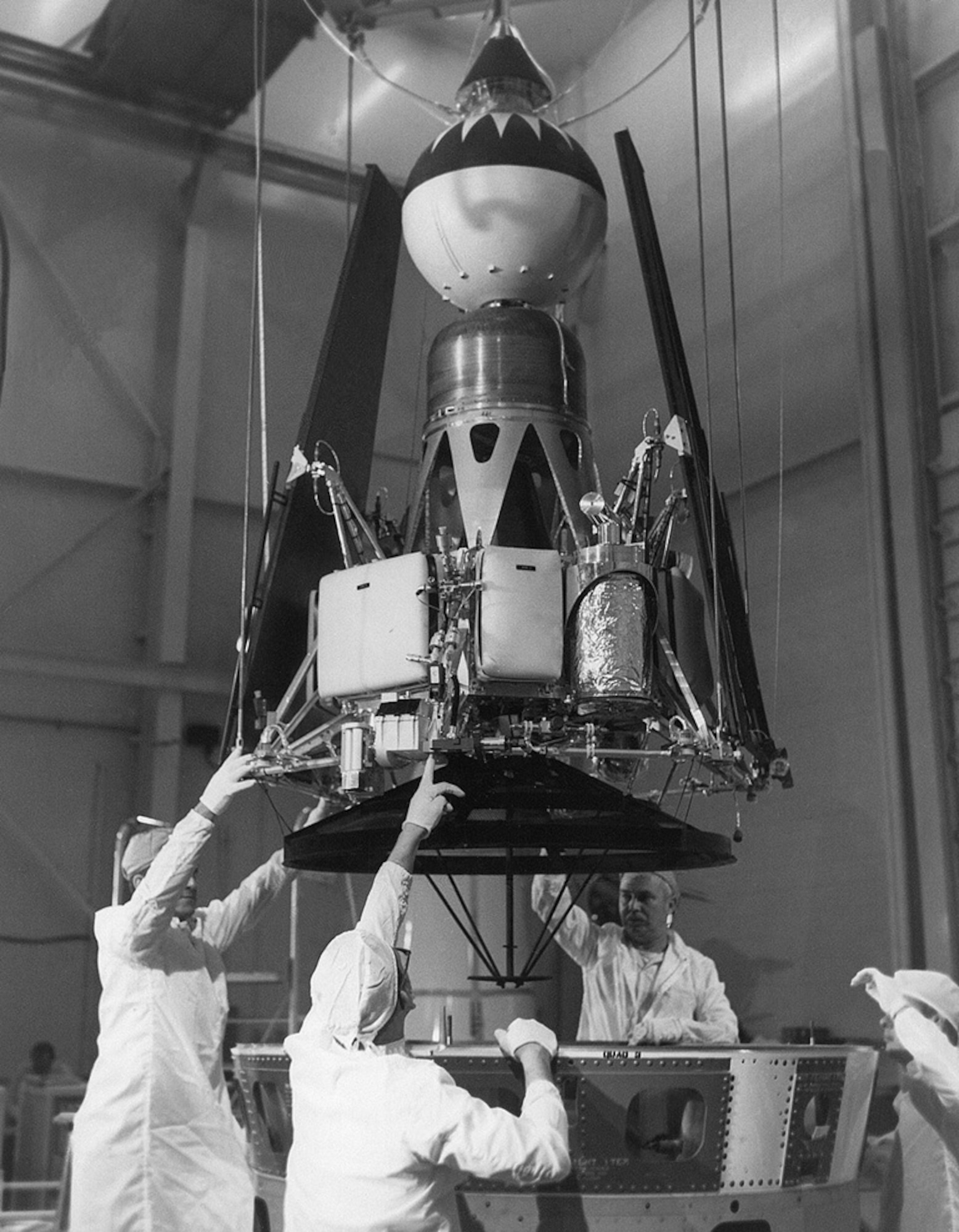 Technicians working on the Ranger 4 satellite, circa 1962. (NASA/JPL Photo)