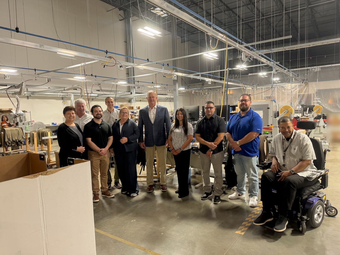Personnel from Defense Logistics Agency Troop Support discuss warehouse operations with representatives at the Travis Association for the Blind in Austin, Texas, April 30, 2026. The DLA team visited the facility to observe operations, review standard operating procedures, and perform physical inventory counts in preparation for an upcoming financial audit.