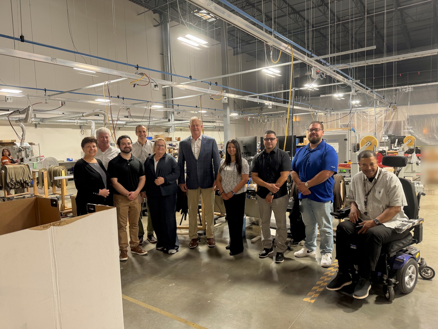 Personnel from Defense Logistics Agency Troop Support discuss warehouse operations with representatives at the Travis Association for the Blind in Austin, Texas, April 30, 2026. The DLA team visited the facility to observe operations, review standard operating procedures, and perform physical inventory counts in preparation for an upcoming financial audit.