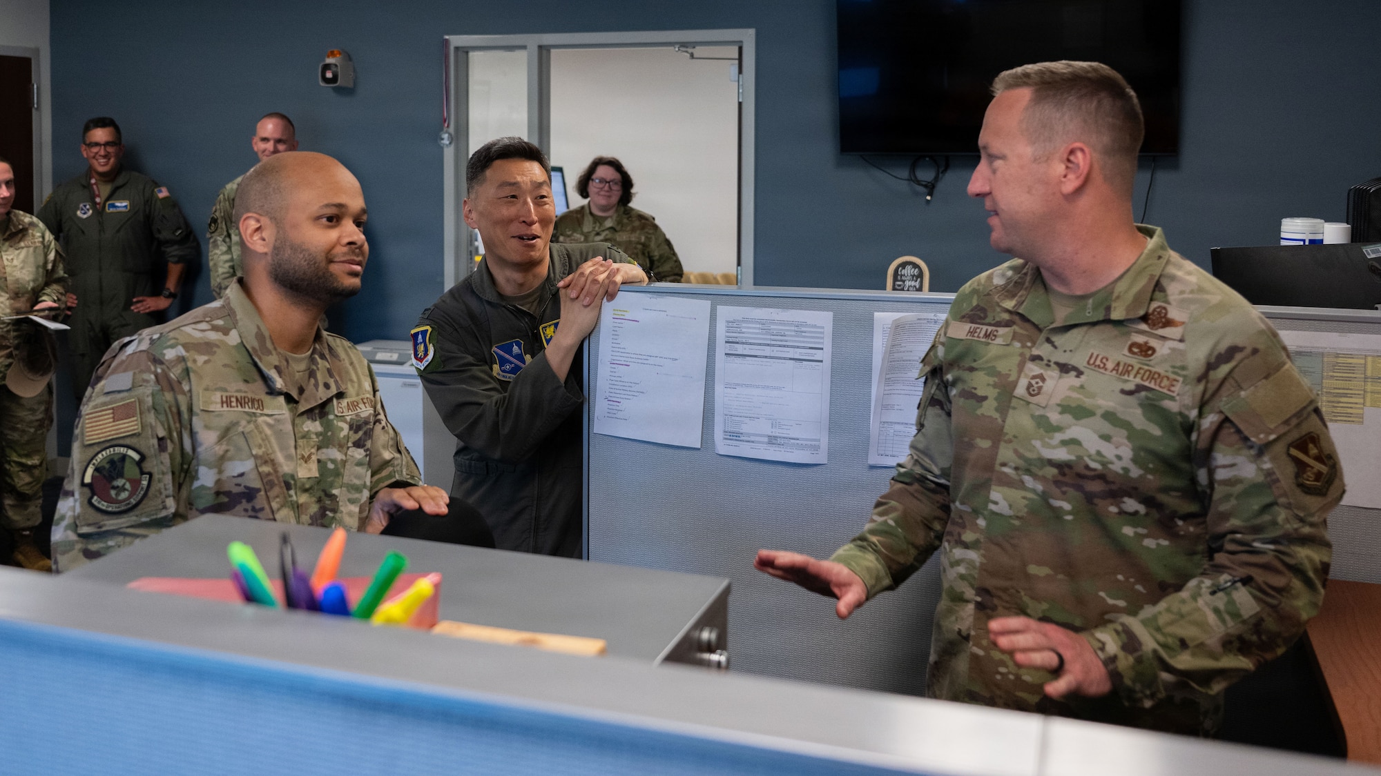 U.S. Air Force Senior Airman Cody L. Henrico, a host aviation resource management journeyman assigned to the 316th Operations Support Squadron, guides Col. Jun S. Oh, 316th Wing and installation commander, and  Chief Master Sgt. Kevin Helms, 316th Wing command chief, through his daily operations during a “Winnin’ Like a Griffin” leadership visit at Joint Base Andrews, Maryland, May 5, 2026.