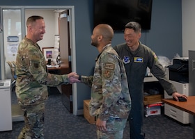 U.S. Air Force Col. Jun S. Oh, 316th Wing and installation commander, and Chief Master Sgt. Kevin Helms, 316th Wing command chief, greet Senior Airman Cody L. Henrico, a host aviation resource management journeyman assigned to the 316th Operations Support Squadron, during a “Winnin’ Like a Griffin” leadership visit at Joint Base Andrews, Maryland, May 5, 2026.